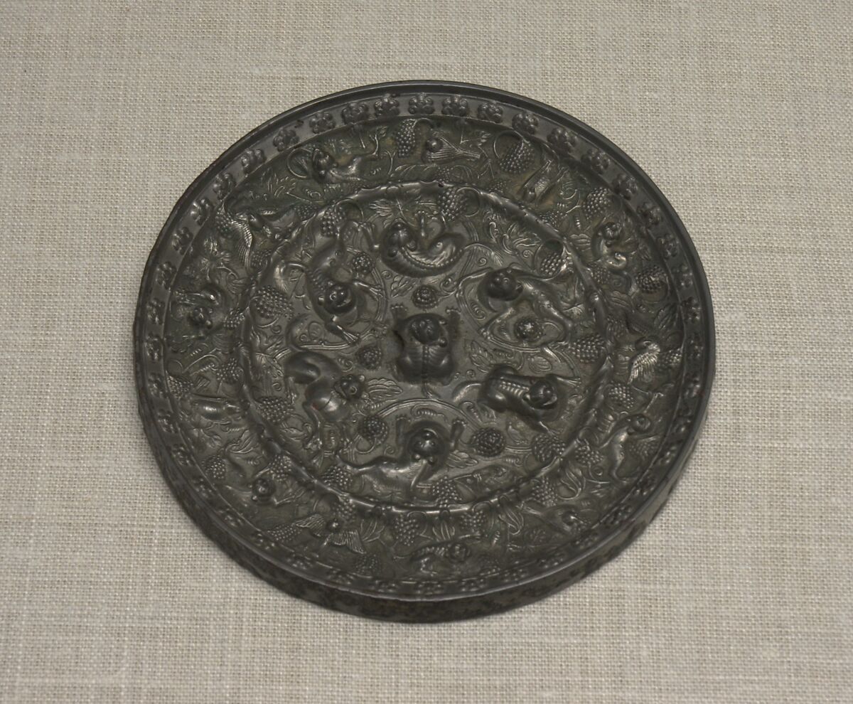 Mirror with fantastic animals amid grape vines, Bronze, China 