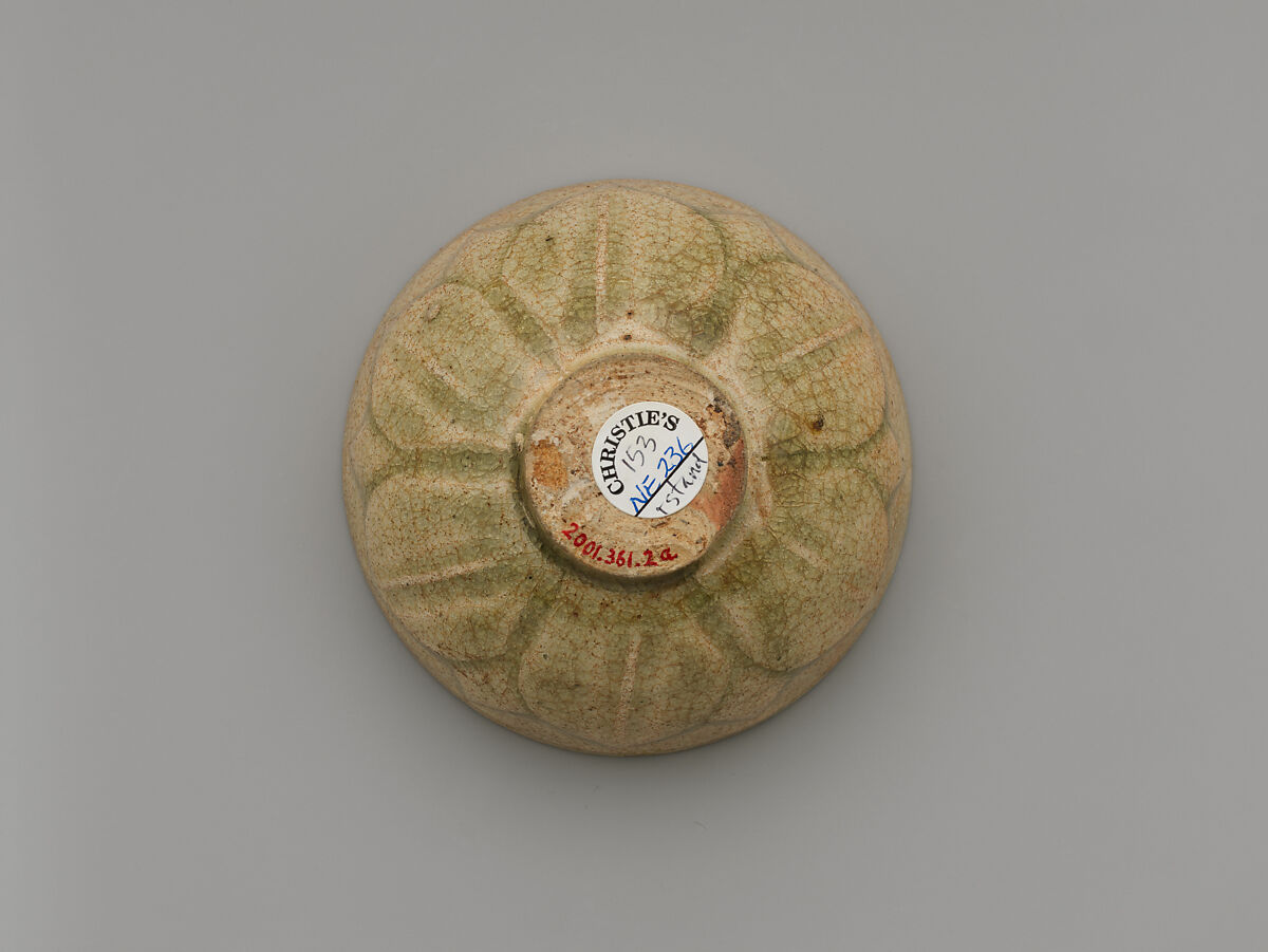 Tea bowl and saucer with lotus decoration, Stoneware with carved decoration under celadon glaze, China