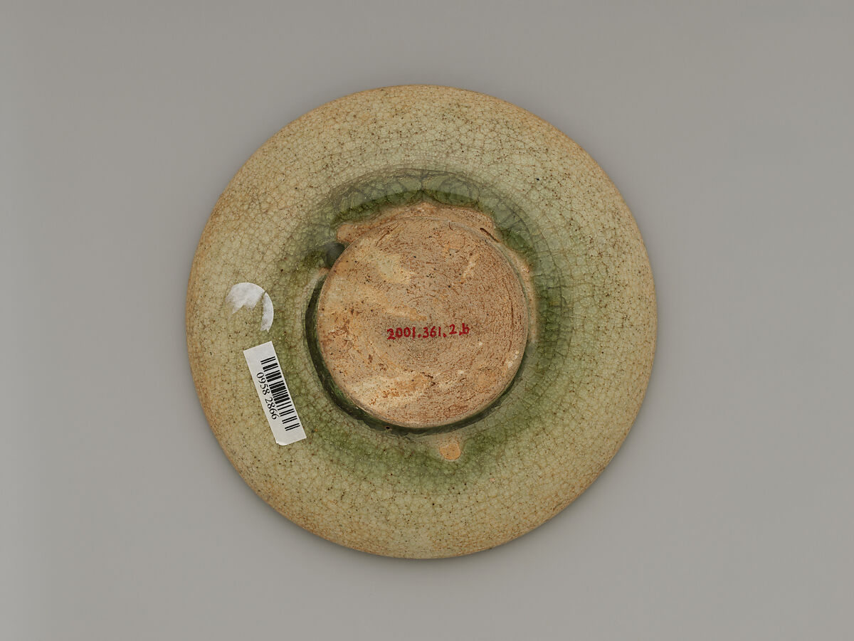 Tea bowl and saucer with lotus decoration, Stoneware with carved decoration under celadon glaze, China