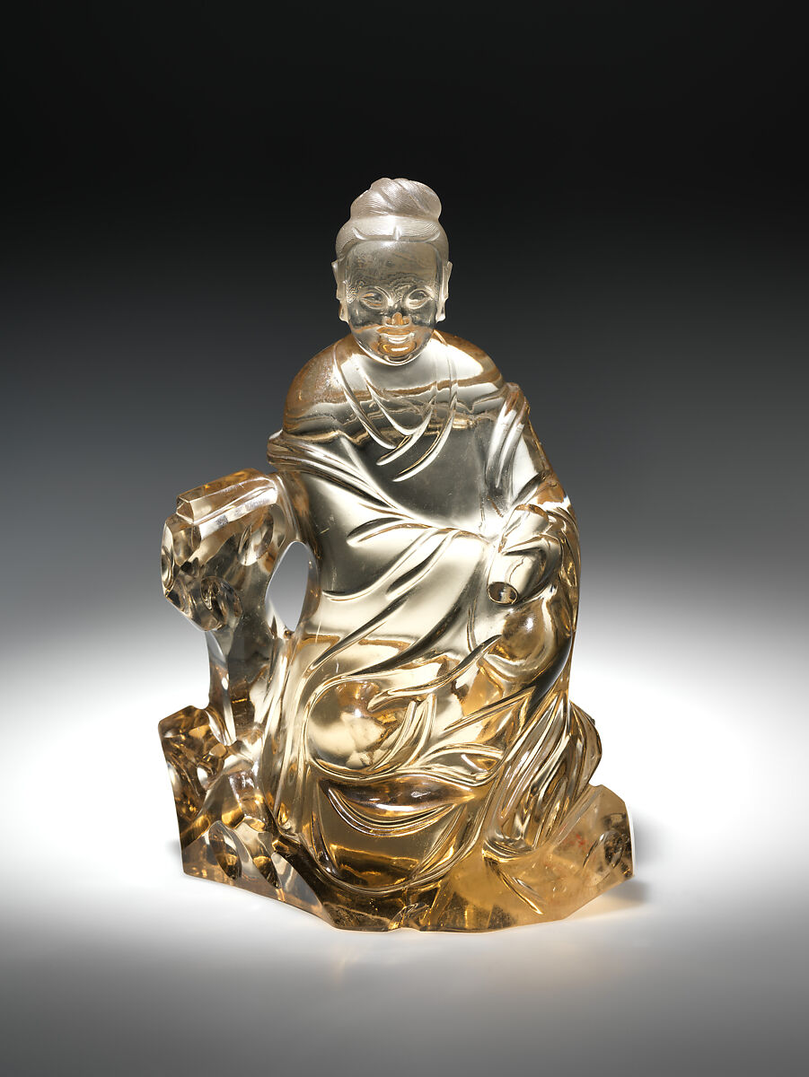 Bodhisattva Guanyin seated on a rock, Smoked crystal, China 