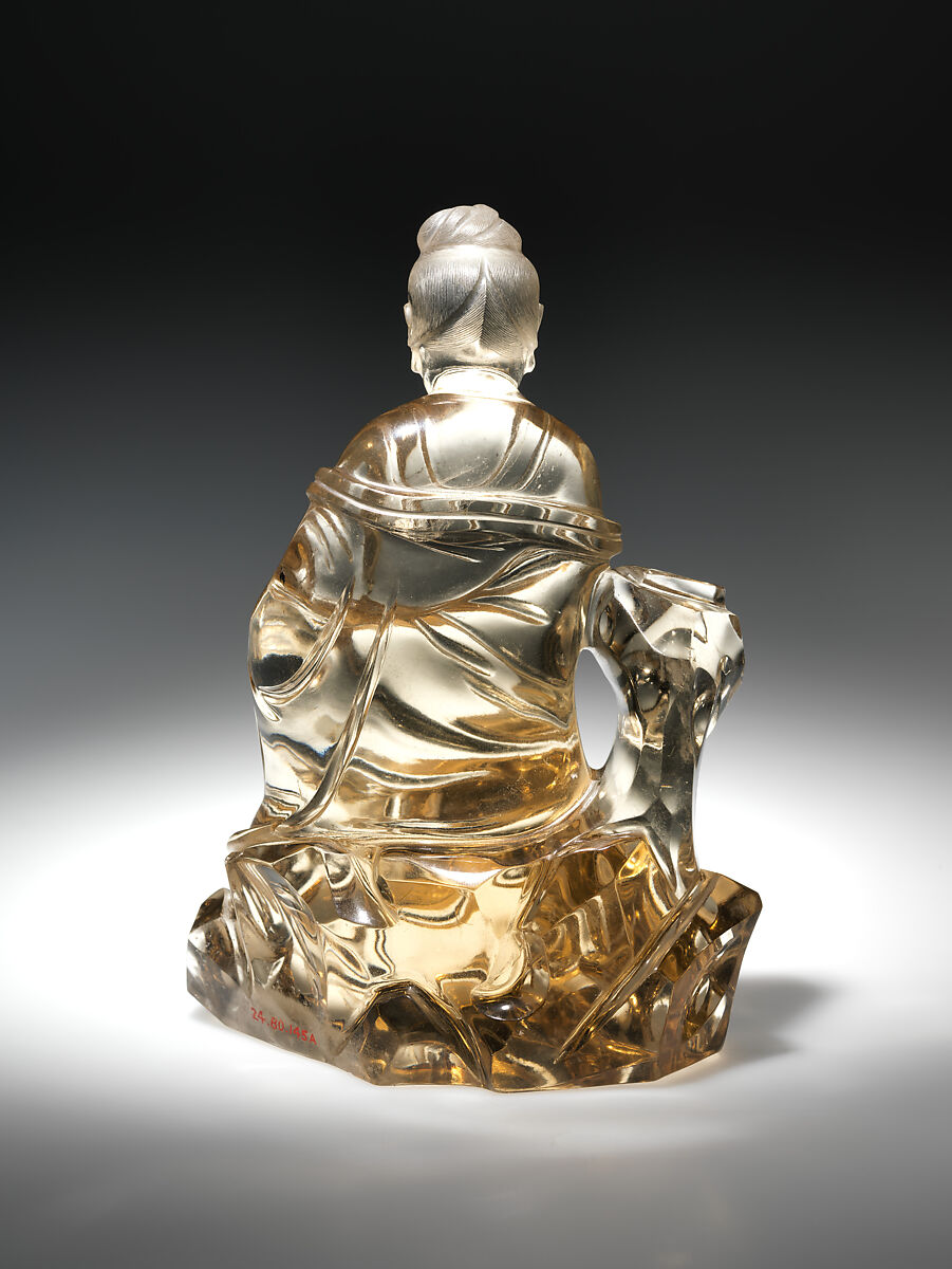 Bodhisattva Guanyin seated on a rock, Smoked crystal, China