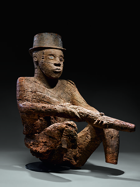 Seated Male Figure with Rifle and Bowler Hat, Wood, Mbembe peoples 