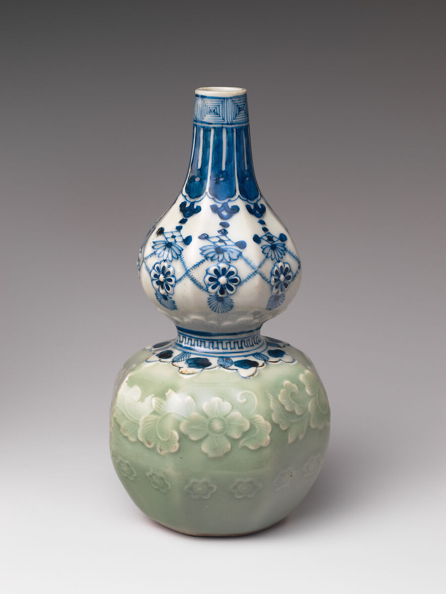 Gourd-Shaped Sake Bottle (Tokkuri) with Carved Floral Design and Jewel, Porcelain with celadon glaze and cobalt blue under transparent glaze (Hizen ware, Arita type), Japan