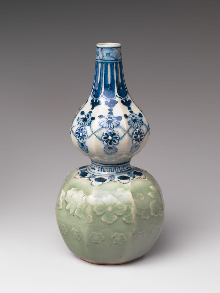 Gourd-Shaped Sake Bottle (Tokkuri) with Carved Floral Design and Jewel, Porcelain with celadon glaze and cobalt blue under transparent glaze (Hizen ware, Arita type), Japan