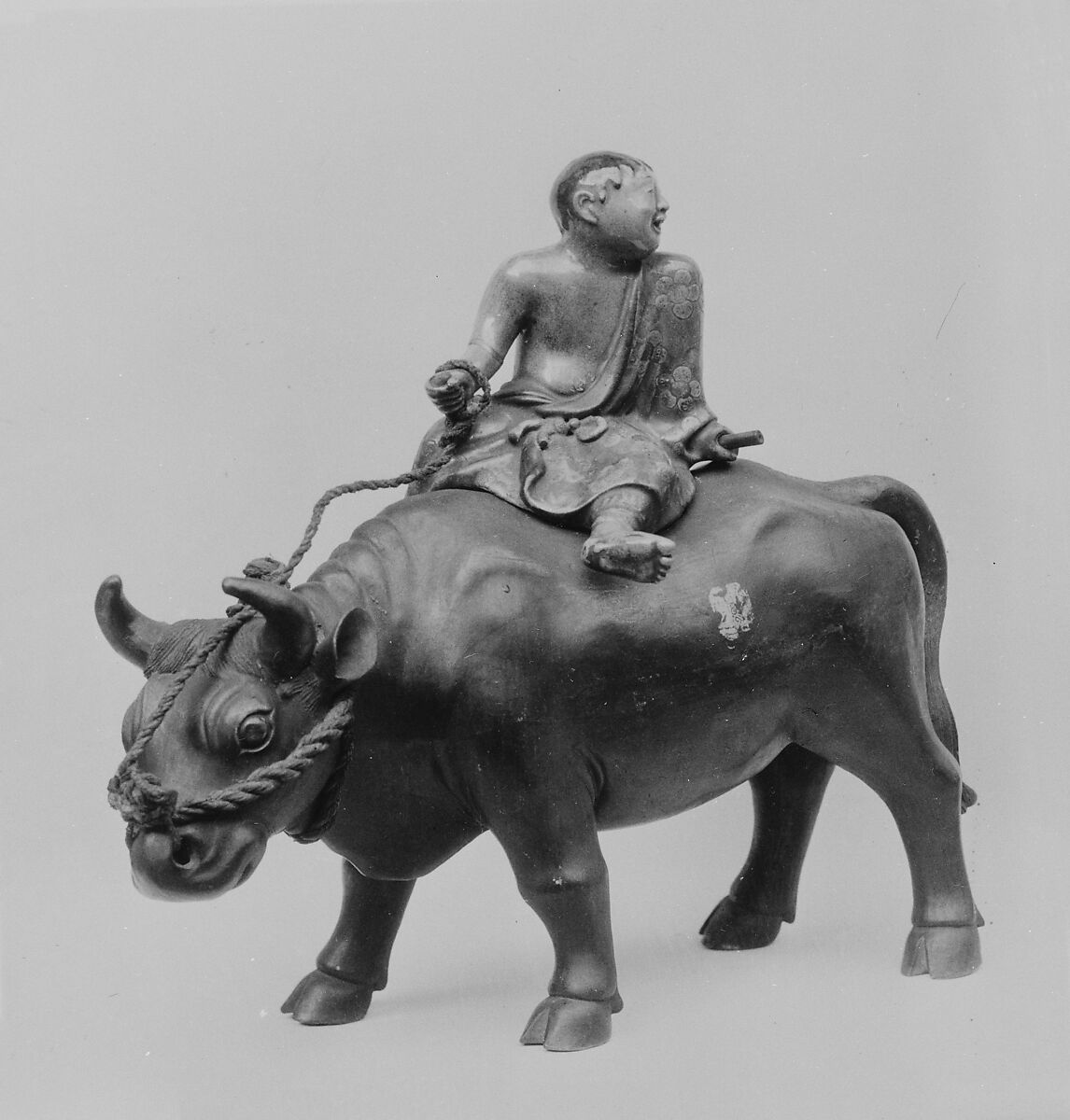 Censer in Form of a Boy Riding an Ox, Faience covered with non-lustrous black glaze, colored and gold enamels (Awata ware), Japan 