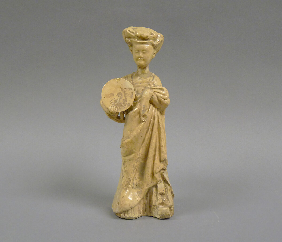 Female attendant carrying a stool, Glazed earthenware, China 