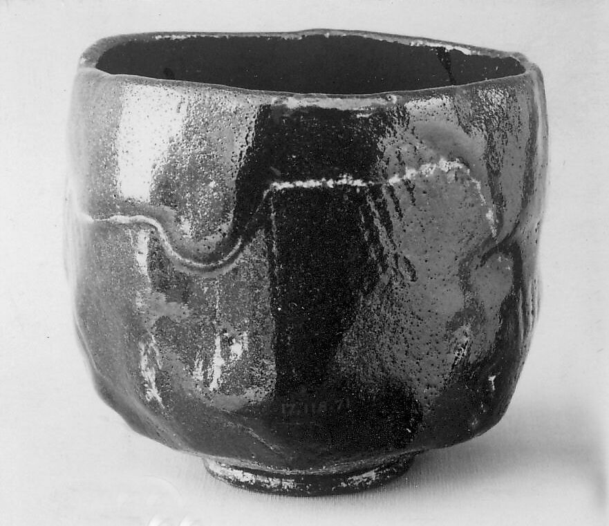 Teabowl, Keinyu (died 1893), Clay covered with a black glaze; on the lower part with a transparent brown glaze (Raku ware), Japan 
