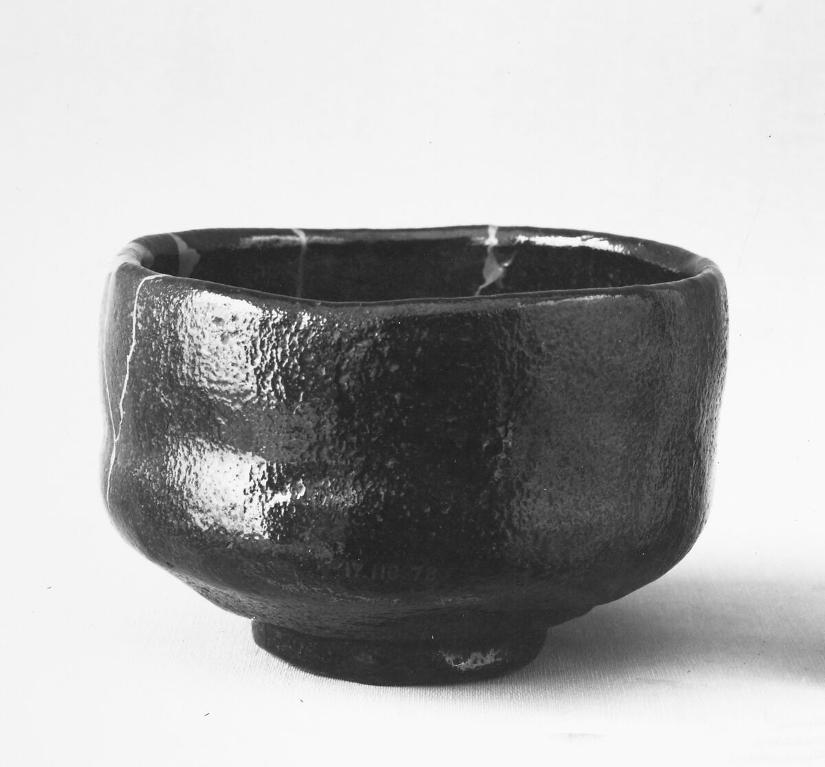 Teabowl, Ichinyu (Japanese, died 1682), Clay covered with a black glaze dappled with red (Raku ware), Japan 