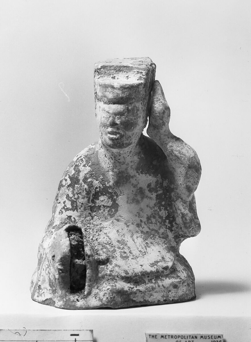 Figure of a Seated Musician, Brownish pottery with traces of color, China 