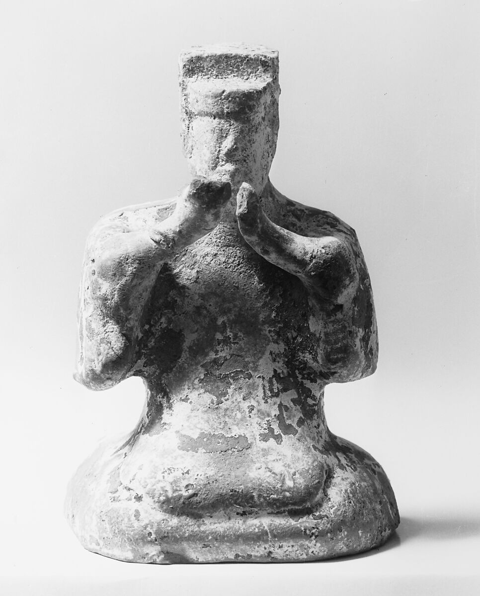 Figure of a Seated Musician Clapping Hands, Dark pottery with slip and bits of color, China 