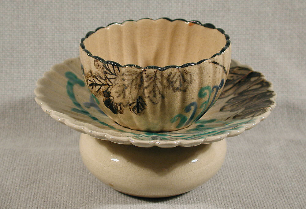 Blossom-Shaped Cup and Matching Cup Stand, Glazed pottery decorated with underglaze cobalt and iron and with overglaze blue and green enamels; Kyoto pottery of Ko-Kiyomizu type, Japan 