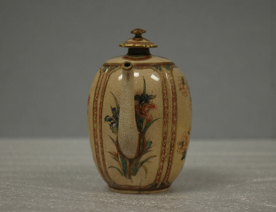 Wine pot, Hard paste faience, lustrous glaze, crackled, over decorations; enameled on top, handle and spout;  (Satsuma ware), Japan