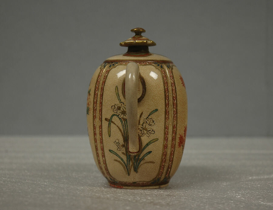 Wine pot, Hard paste faience, lustrous glaze, crackled, over decorations; enameled on top, handle and spout;  (Satsuma ware), Japan