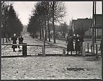 [East Berlin Women Waving to their West Berlin Friends Across the Barbed-Wire Barricade, Which Later Became the Berlin Wall]