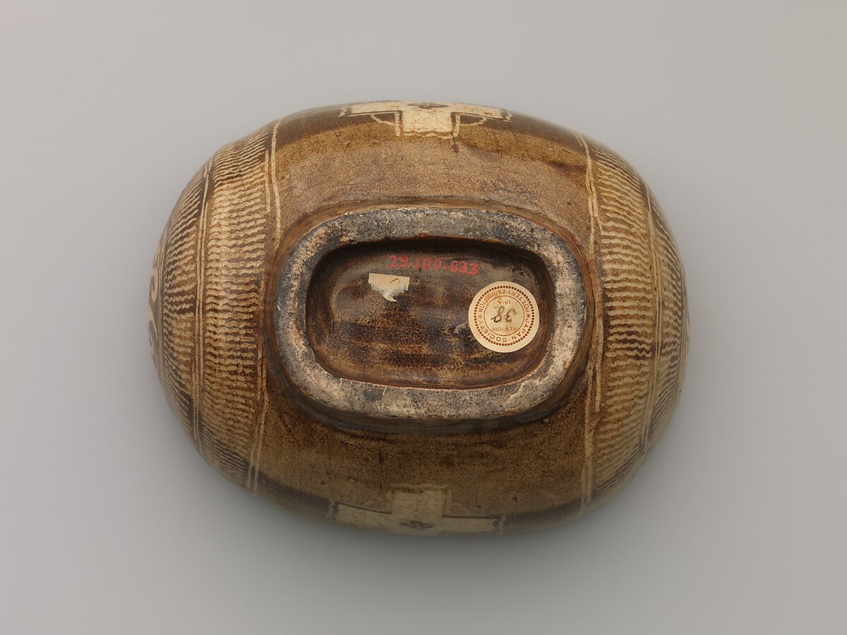 Tea Bowl with Cross Design, Clay with inlaid Mishima design under transparent crackled glaze; inside has flecked glaze (Kyoto ware), Japan