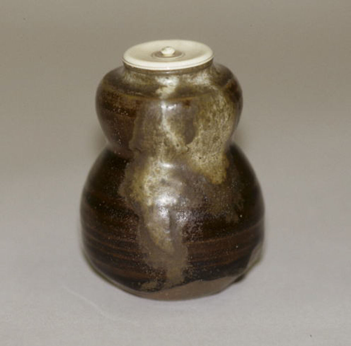 Tea jar, Clay, thick brown glaze with splashes on neck and shoulder (Seto ware), Japan 