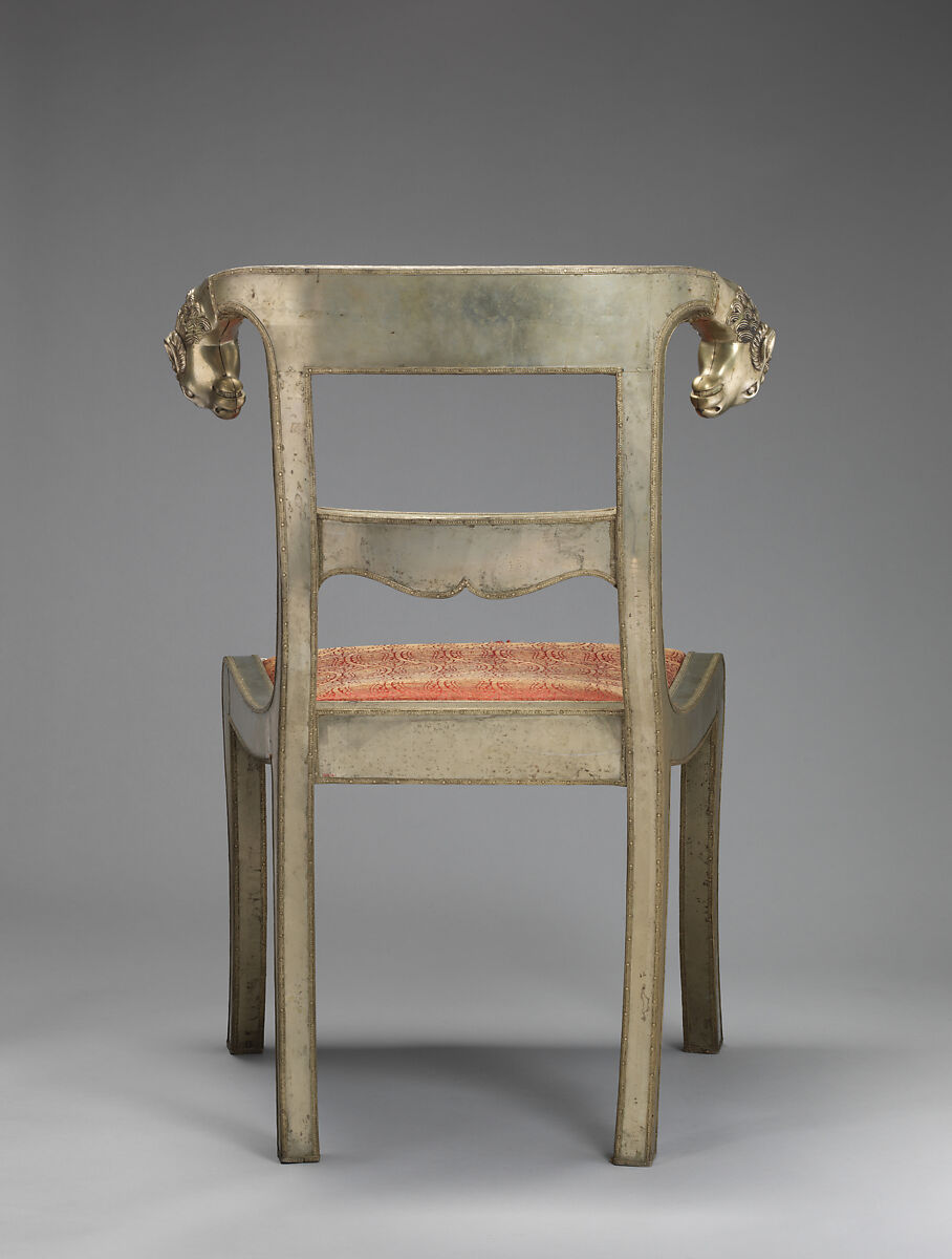 Side chair with rams' heads (one of a pair), White alloy metal sheets (silvered?) over wooden core, probaly teak; silk and metallic woven textile, Anglo-Indian