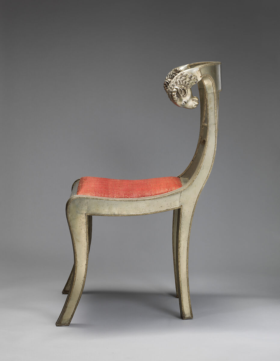 Side chair with rams' heads (one of a pair), White alloy metal sheets (silvered?) over wooden core, probaly teak; silk and metallic woven textile, Anglo-Indian