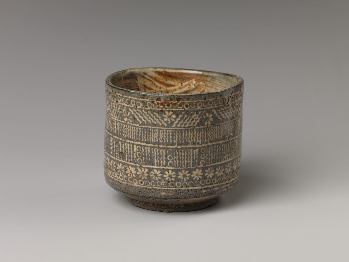 Tea bowl with decoration of chrysanthemums and wavy lines, Stoneware with stamped, white-slip design, Probably Korea