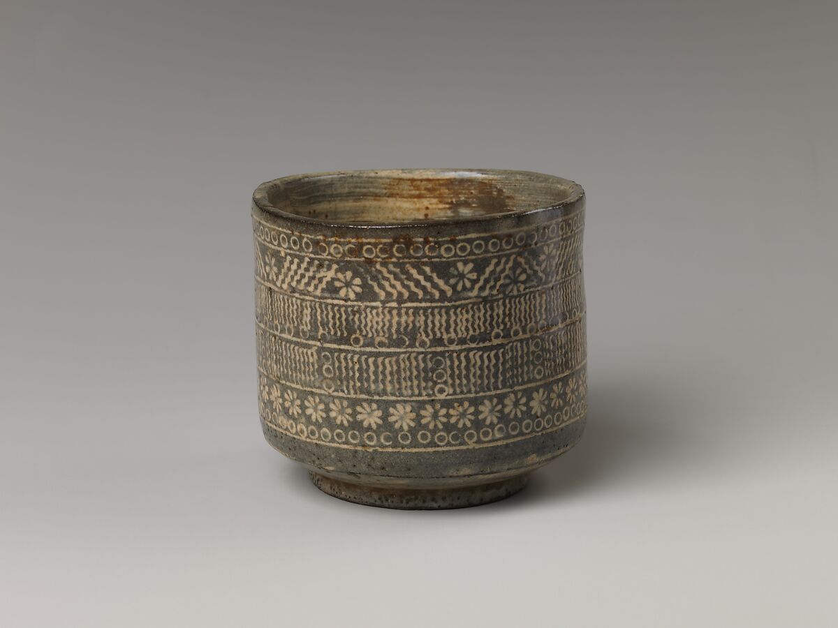 Tea bowl with decoration of chrysanthemums and wavy lines, Stoneware with stamped, white-slip design, Probably Korea