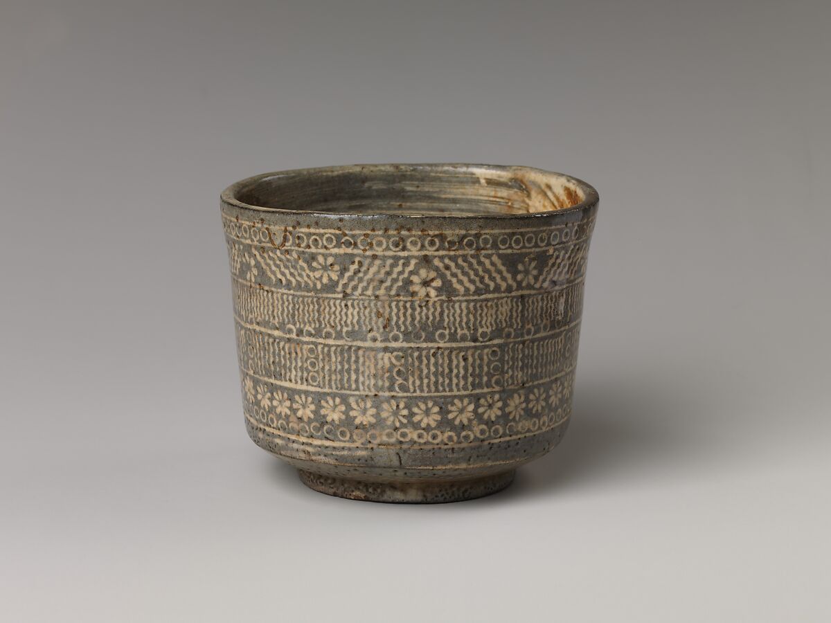 Tea bowl with decoration of chrysanthemums and wavy lines, Stoneware with stamped, white-slip design, Probably Korea 