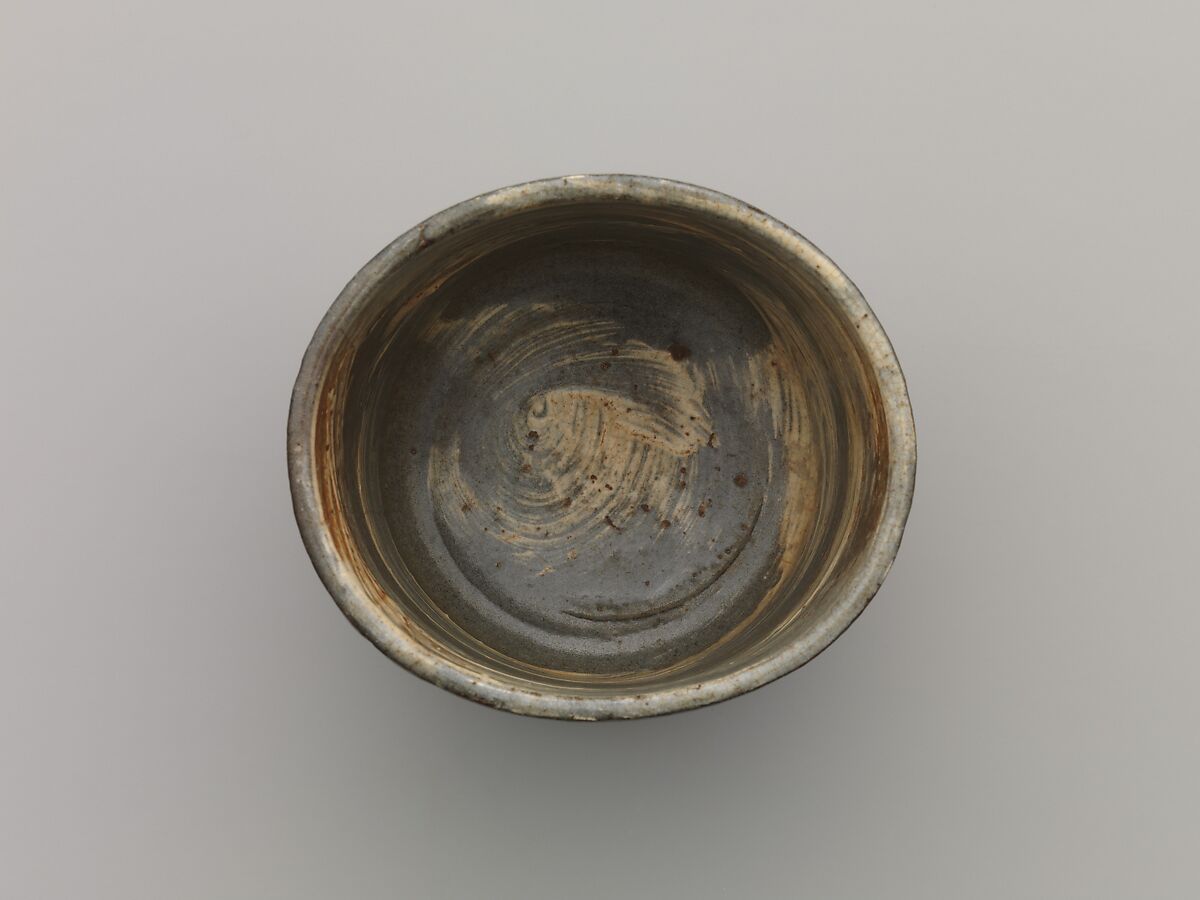 Tea bowl with decoration of chrysanthemums and wavy lines, Stoneware with stamped, white-slip design, Probably Korea