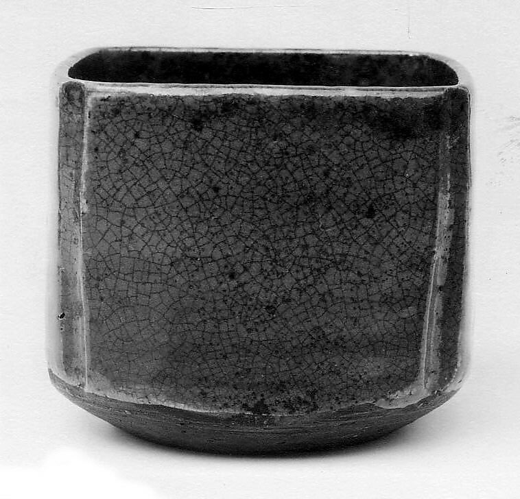 Teabowl, Hachiroemon Murase II (Japanese,), Clay, pitted; thin, crackled glaze over gray glaze, burned black near the edges (Owari ware, Fujimi type), Japan 