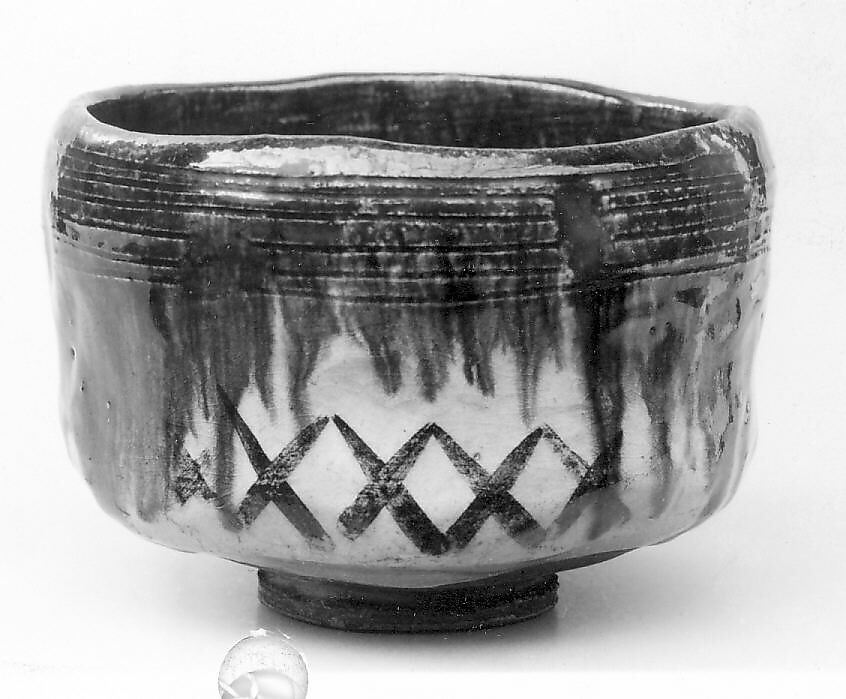 Teabowl, Keinyu (died 1893), Cylindrical with small foot; horizontal lines incised below uneven lip; brown clay with creamy glaze and green overglaze; brown latticed strokes; inside, three flying birds suggested (Raku ware), Japan 