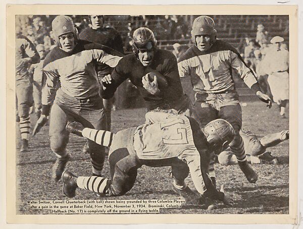 Walter Switzer, Cornell Quarterback shown being grounded by three Columbia Players, from the 