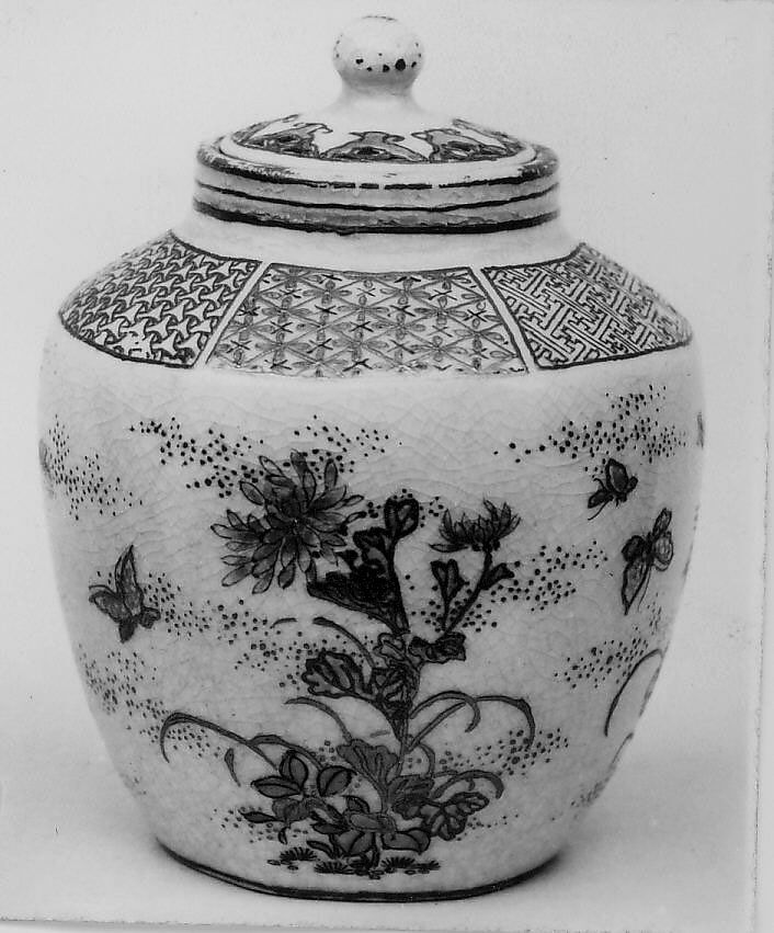 Miniature Covered Jar, Porcelain, roughly hexagonal with enamel decoration of butterflies and flowering plants in pale green, blue and rose, with gold tracery and leaves, on creamy white crackled glaze; six different diaper designs in gold with some blue and red enamel on shoulder; three gold bands on neck; cover bordered with floral decoration in red and blue (Satsuma ware), Japan 
