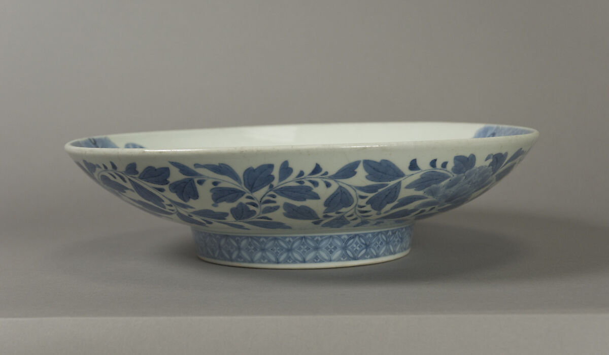 Dish with Assorted Treasures Floating on Waves, Porcelain with cobalt blue under transparent glaze (Hizen ware, Nabeshima type), Japan