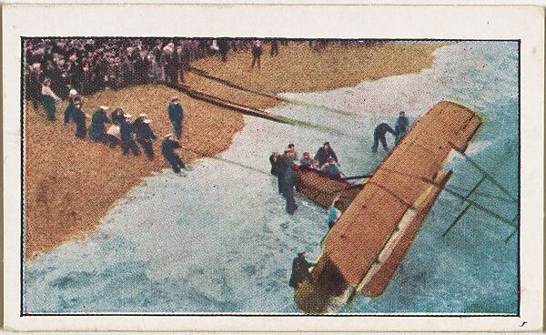 Card No. 235, Pulling Ashore a British War Aeroplane Wrecked During a Scouting Trip Over the North Sea, from the World War I Scenes series (T121) issued by Sweet Caporal Cigarettes, Issued by American Tobacco Company, Photolithograph 