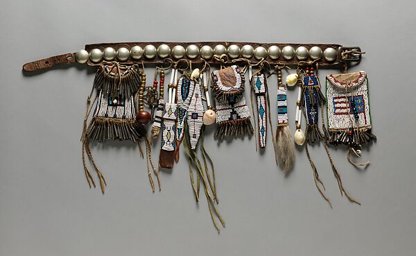 Girl's Belt Set, Commercial and native-tanned leather, German-silver conchos, glass beads, metal cones, cowrie shells, brass beads, bone, deer tails, pigment, shell, wooden bead, brass gear, metal key, Southern Cheyenne 