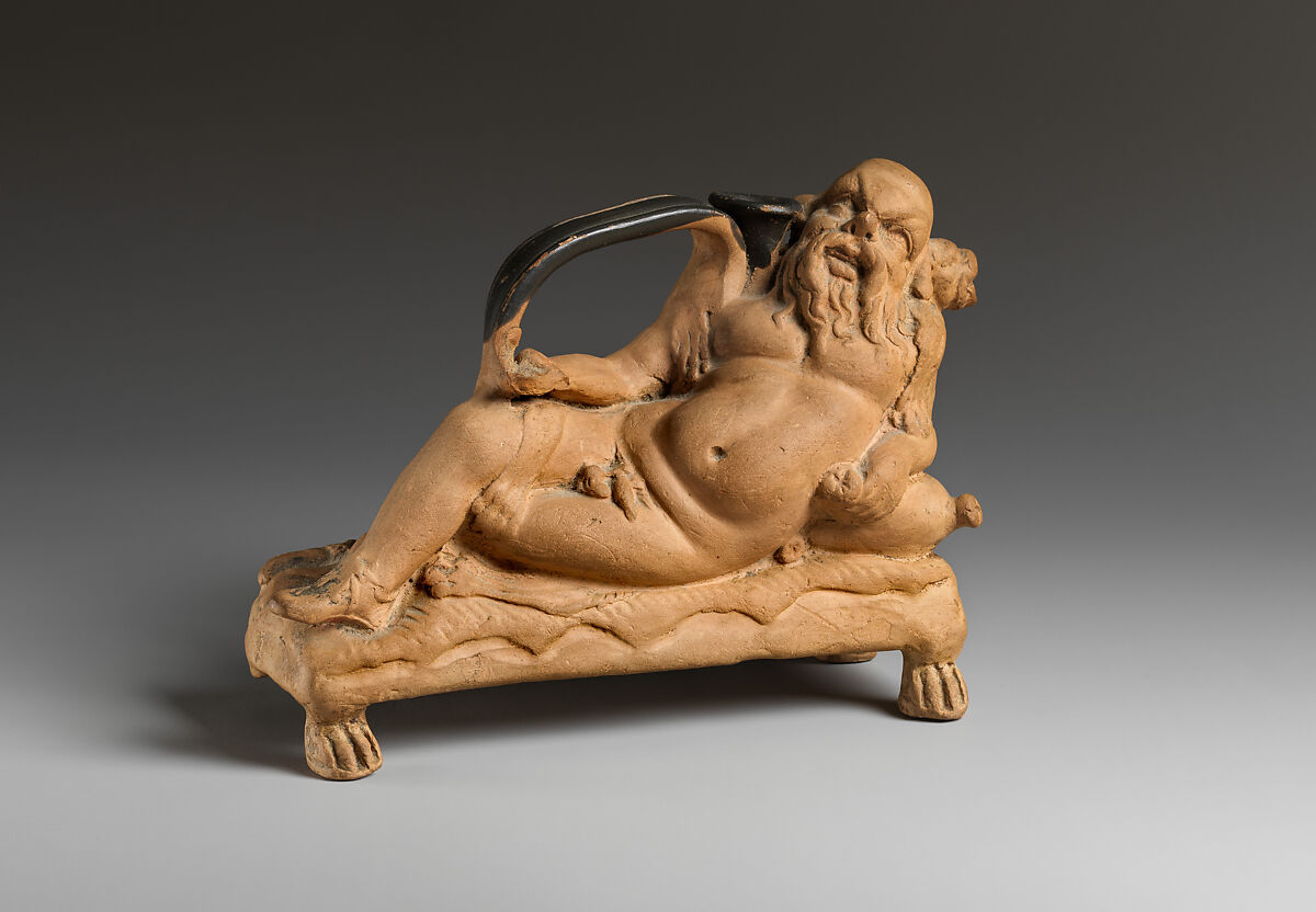 Terracotta askos in the shape of Silenus, Terracotta, with traces of red, Greek, South Italian
