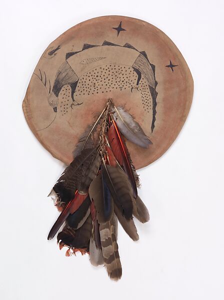 Shield with Supernatural Being, Wood (probably willow), muslin, pigment, ink, wool cloth, cotton string, turkey, hawk, owl and eagle feathers, Cheyenne or Lakota (Teton Sioux) 