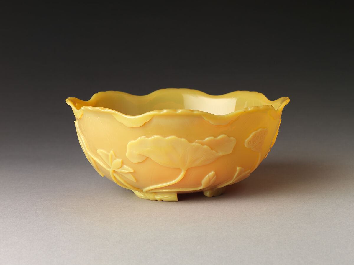 Bowl in the shape of a lotus leaf, Yellow glass with carved and incised decoration, China 