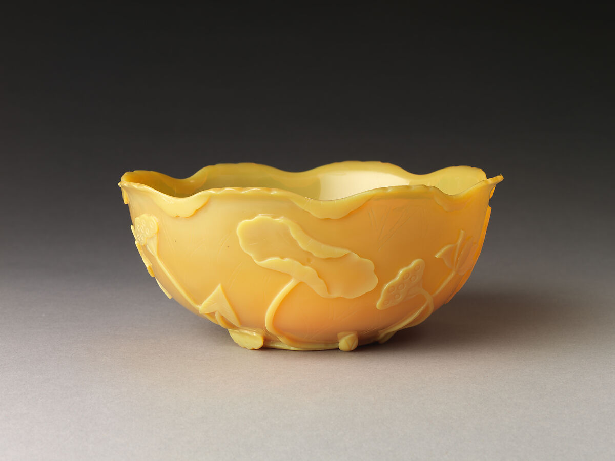 Bowl in the shape of a lotus leaf, Yellow glass with carved and incised decoration, China