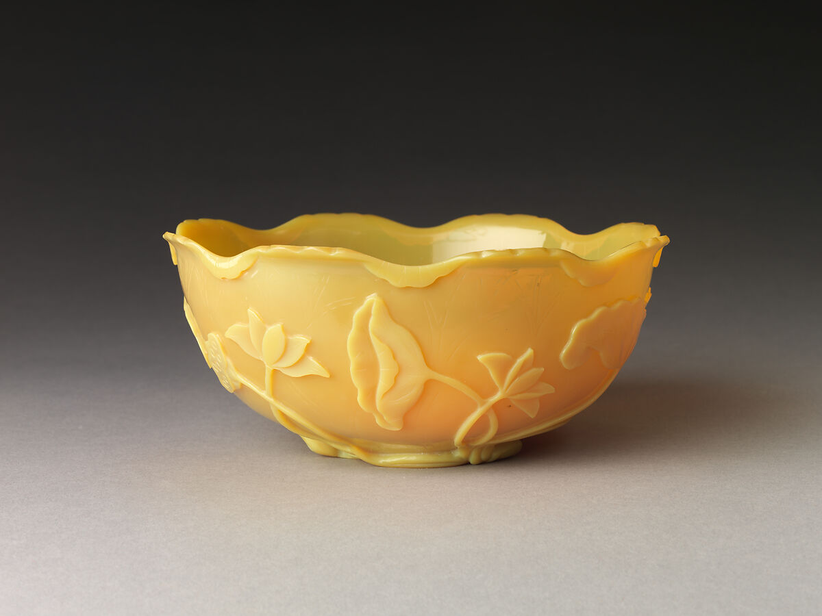 Bowl in the shape of a lotus leaf, Yellow glass with carved and incised decoration, China