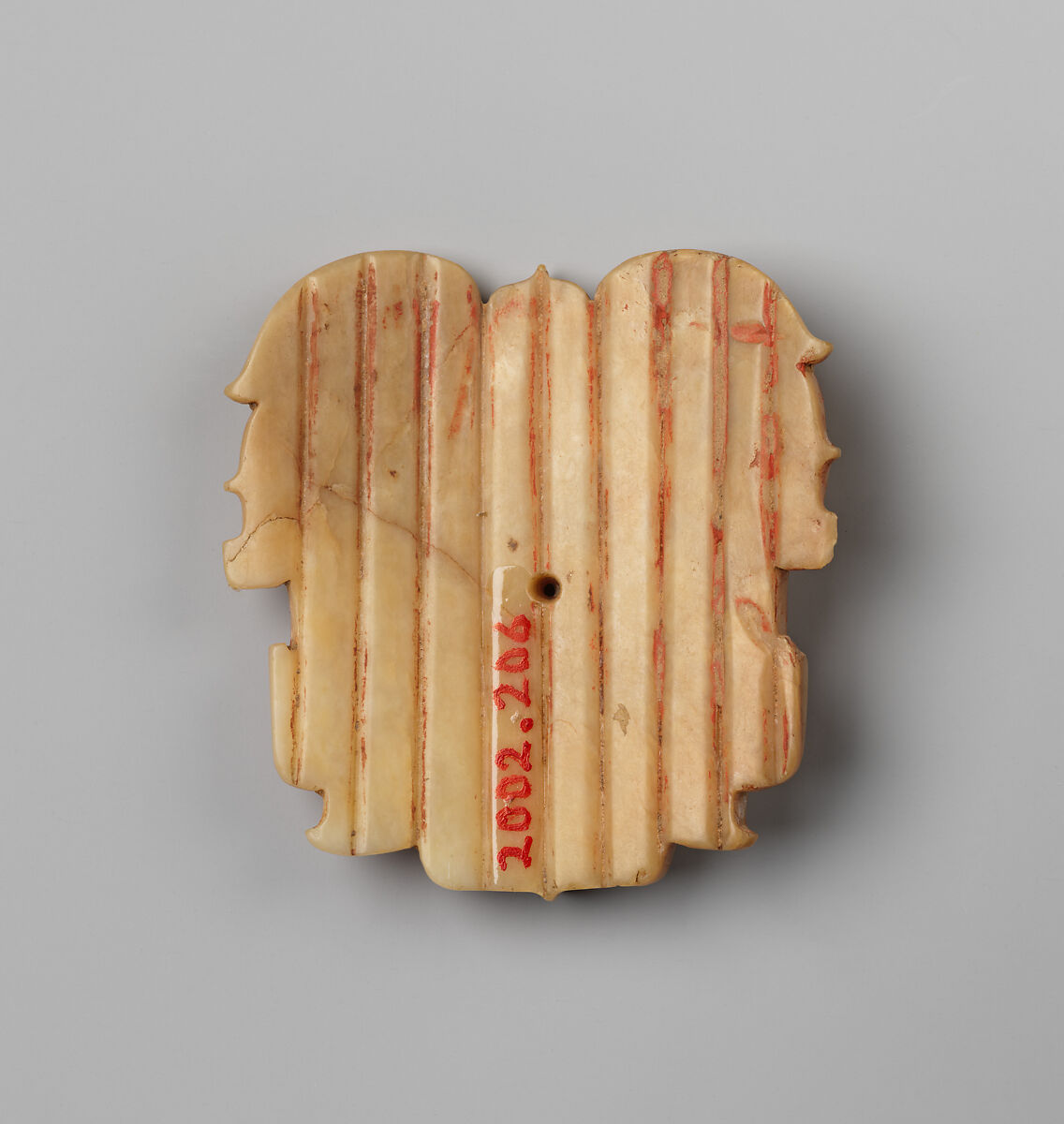 Plaque with mask designs, Jade (nephrite), China