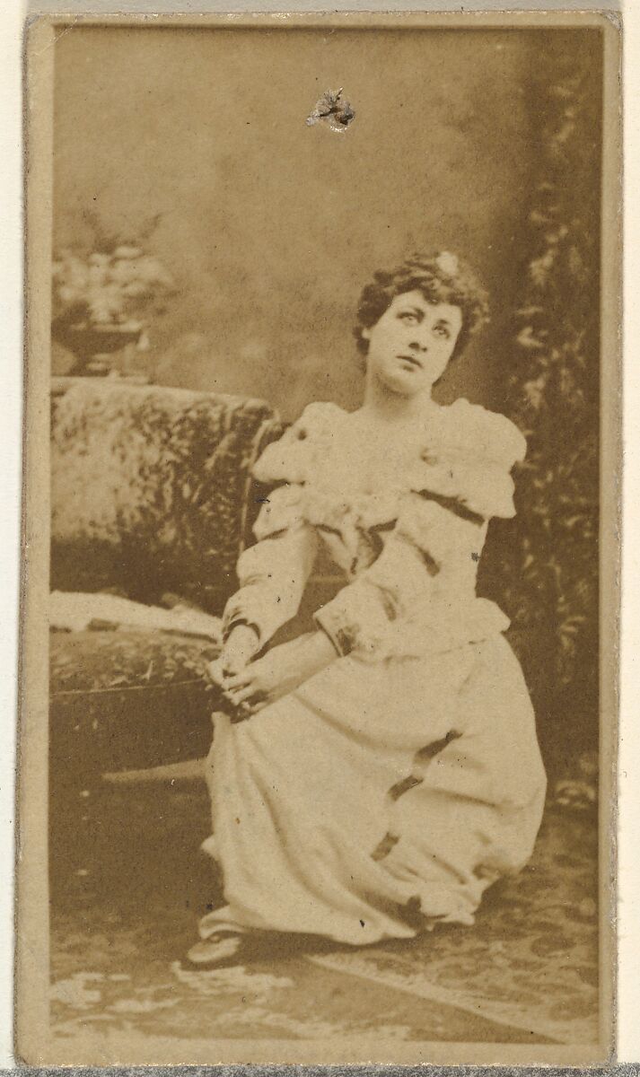 [Seated actress wearing dress with ruffled sleeves], from the Actors and Actresses series (N145-8) issued by Duke Sons & Co. to promote Duke Cigarettes, Issued by W. Duke, Sons &amp; Co. (New York and Durham, N.C.), Albumen photograph 