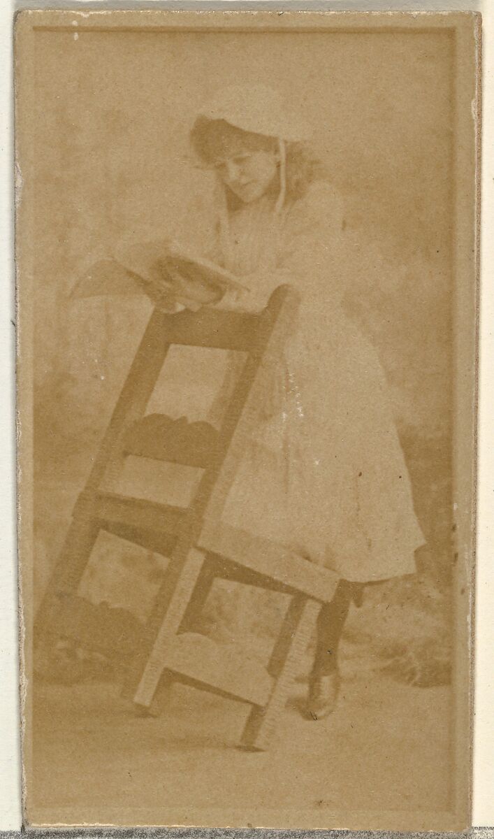 [Actress reading book while leaning on chair], from the Actors and Actresses series (N145-8) issued by Duke Sons & Co. to promote Duke Cigarettes, Issued by W. Duke, Sons &amp; Co. (New York and Durham, N.C.), Albumen photograph 