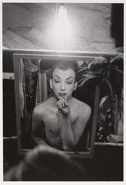 Female impersonator putting on lipstick, Hempstead, L.I., Diane Arbus (American, New York 1923–1971 New York), Gelatin silver print 
