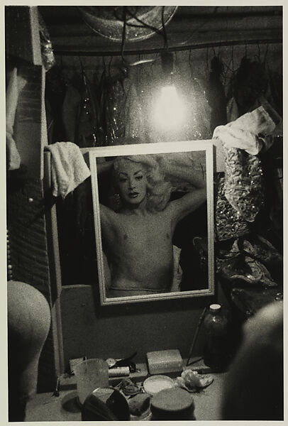 Blonde female impersonator framed in a mirror beneath a light bulb, N.Y.C., Diane Arbus (American, New York 1923–1971 New York), Gelatin silver print 