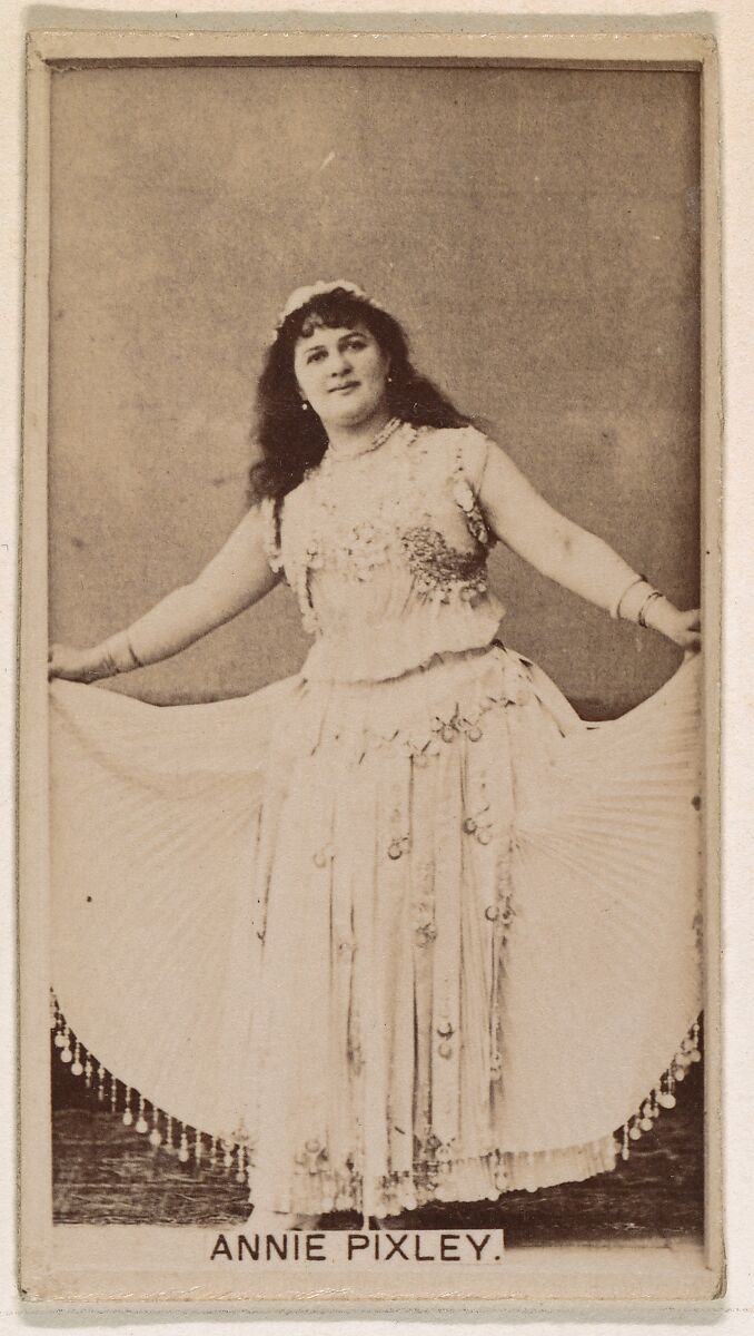 Issued by Kinney Brothers Tobacco Company, Annie Pixley, from the Actresses  series (N245) issued by Kinney Brothers to promote Sweet Caporal Cigarettes