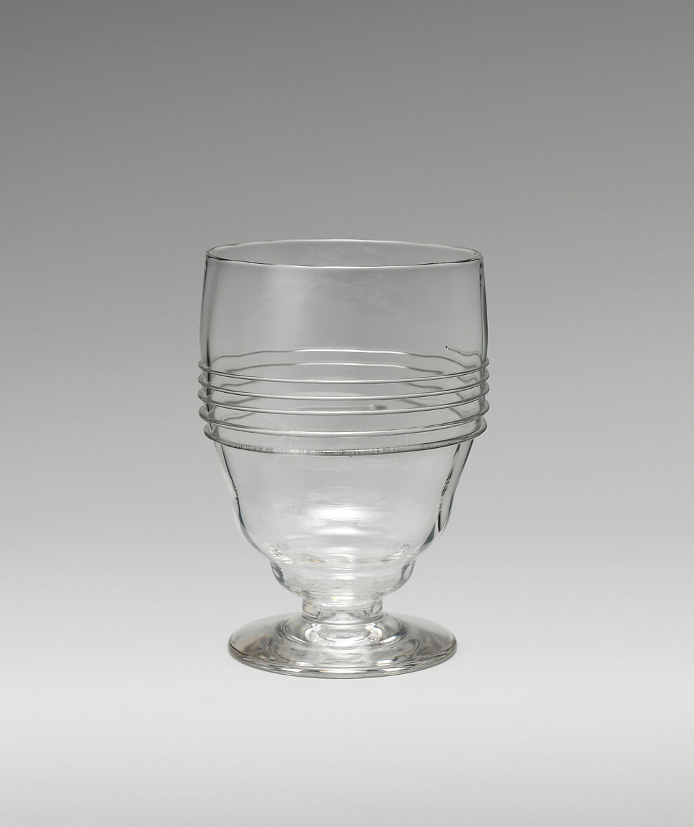 Footed goblet with bulging bowl, Philip Webb (British, Oxford 1831–1915 West Sussex), Flint glass, British, London 