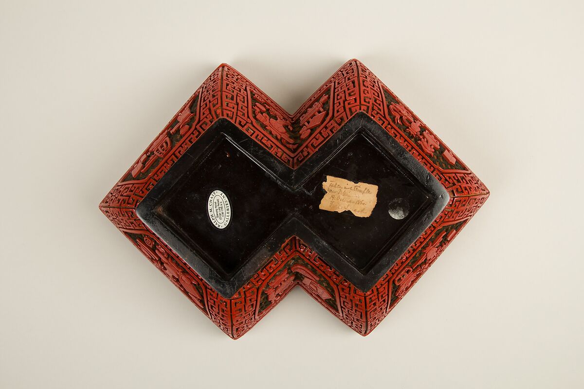 Lozenge box with scene of treasure tributary, Carved red lacquer, China