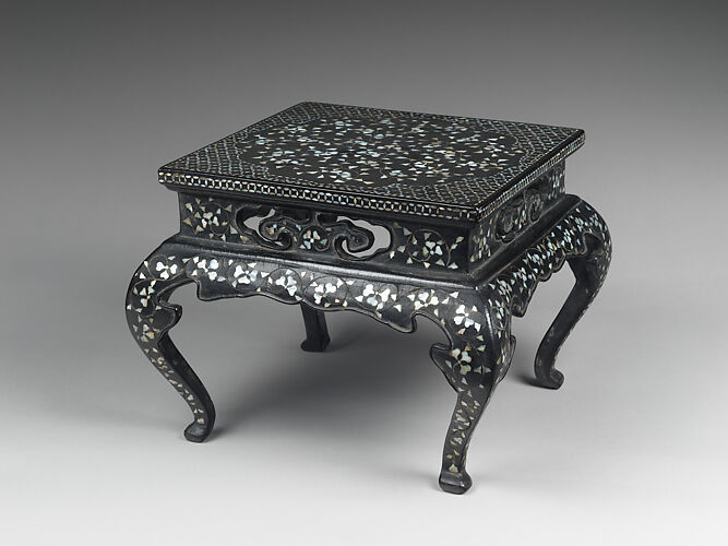 Table decorated with floral scroll