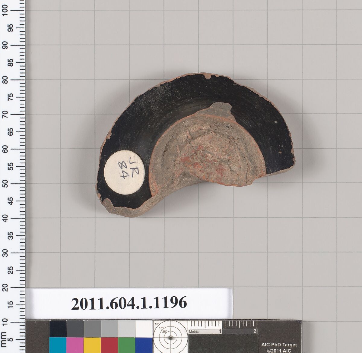 Terracotta fragment of a kylix (drinking cup), Terracotta, Greek, Attic