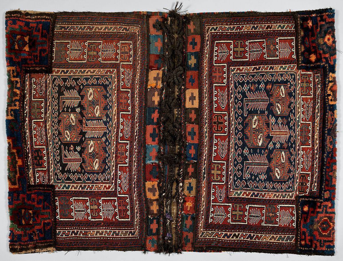 Double Flour Bag, Wool (warp, ground weft, sumak weft, and pile) and goat(?) hair (braided loops); sumak extra-weft wrapping, tapestry (kilim) with dovetailing, and border pattern in complementary weft weave (front); symmetrically knotted pile (top and bottom edges); weft-faced plain weave with two areas of pattern in sumak extra-weft wrapping with twined and braided loop closures (back) 