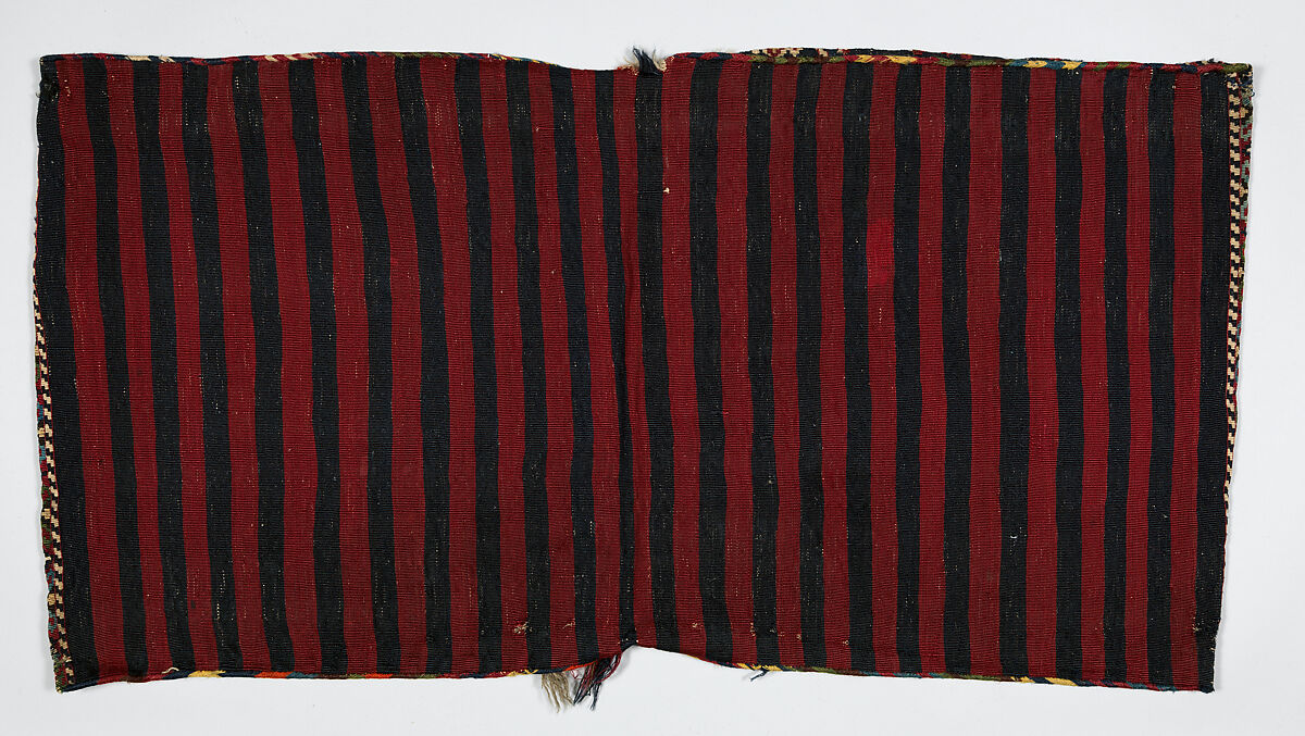 Double Saddle Bag (Heybe), Wool (warp and weft); copper coated with brass metal strip wrapped around cotton core (weft); slit tapestry (kilim), weft-faced plain weave, diagonal ridge sumak outline, closure in oblique plaiting, and plaited warp fringe (front); weft-faced plain weave (back)